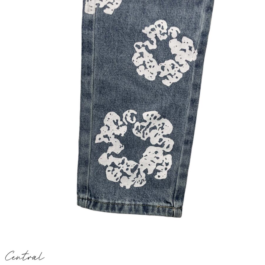 Light wash Denim Tears Levi's Cotton Wreath jeans featuring a unique floral design and relaxed fit.