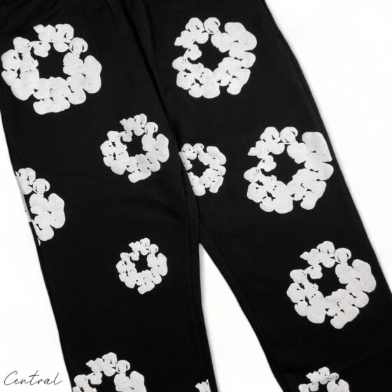 Black sweatpants from Central AE featuring a unique cotton wreath design and a comfortable fit.