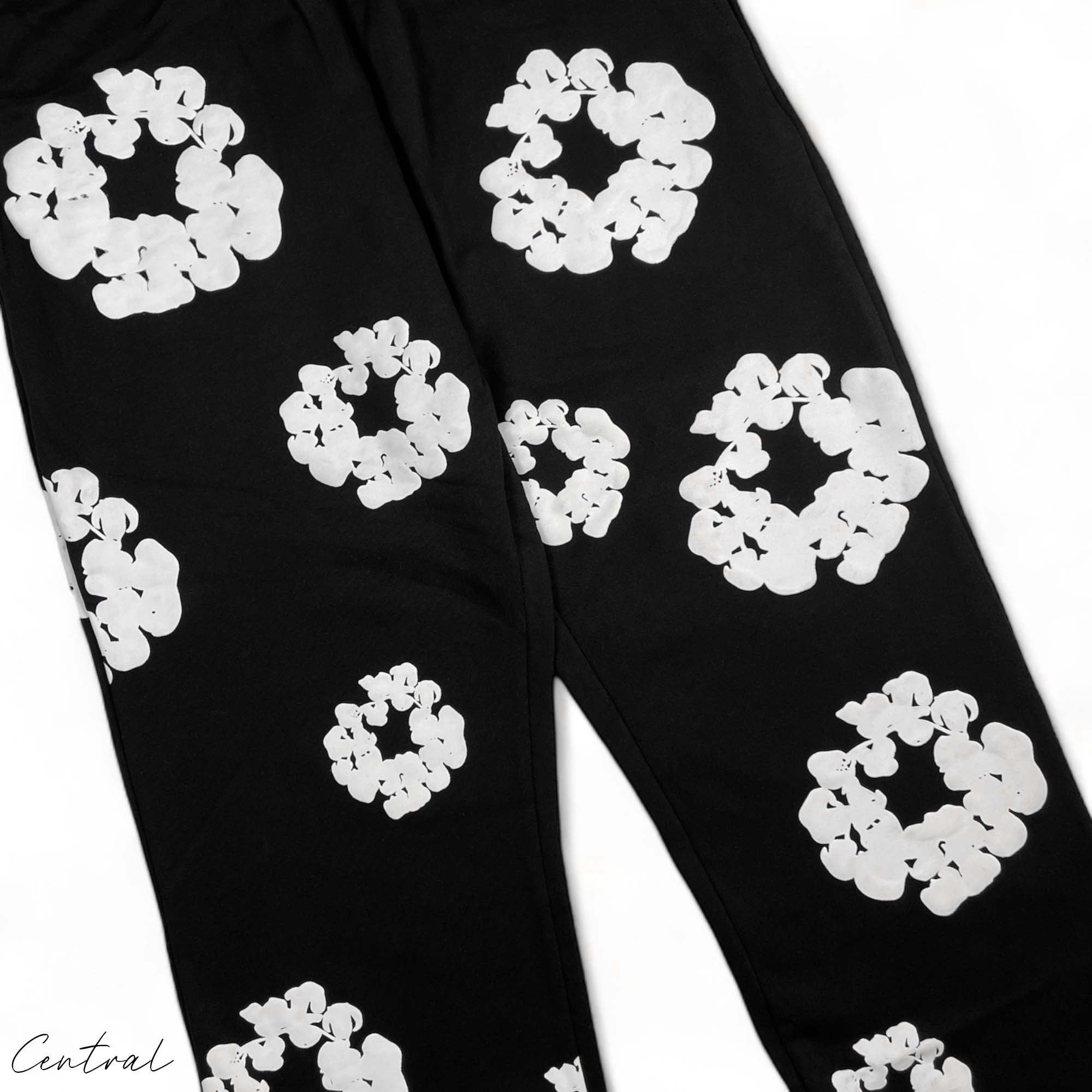 Black sweatpants from Central AE featuring a unique cotton wreath design and a comfortable fit.