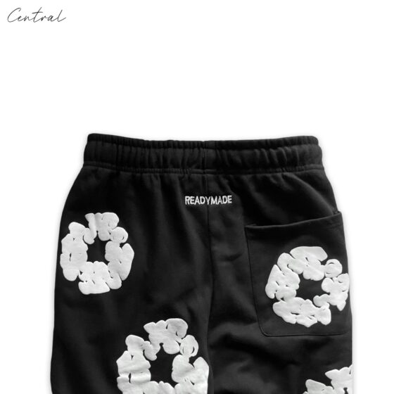 Black READYMADE x DENIM TEARS sweatpants in size M displayed with a relaxed fit and stylish design.
