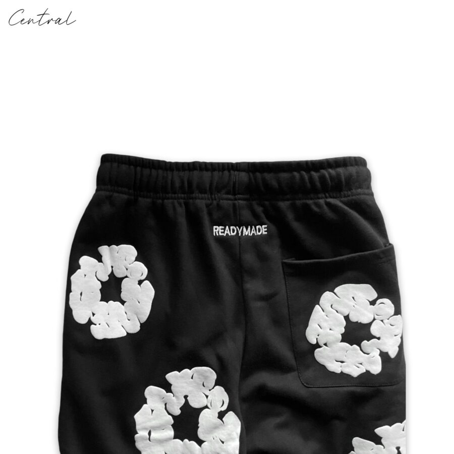 Black READYMADE x DENIM TEARS sweatpants in size M displayed with a relaxed fit and stylish design.