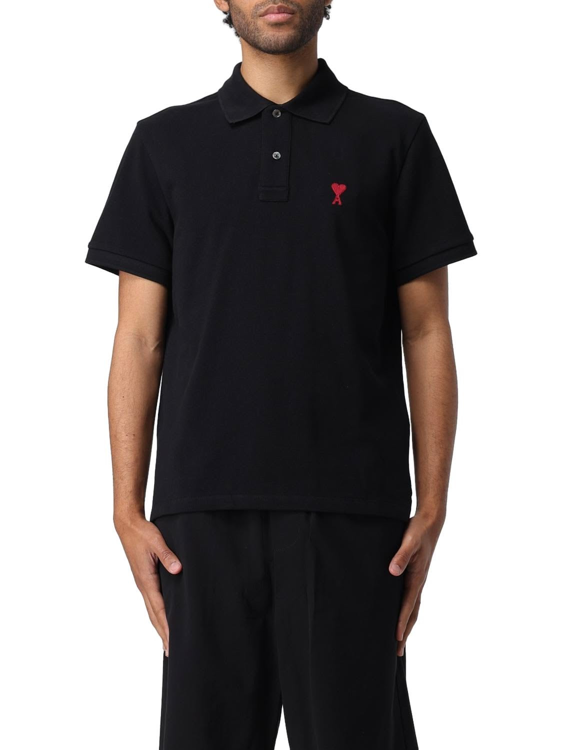 Ami Paris ADC embroidered polo shirt in navy blue, featuring a classic collar and detailed embroidery on the chest.