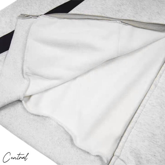 Corteiz Ribbed Sporteiz Zip Hoodie in black, featuring a full zip front and ribbed texture, displayed on a hanger.