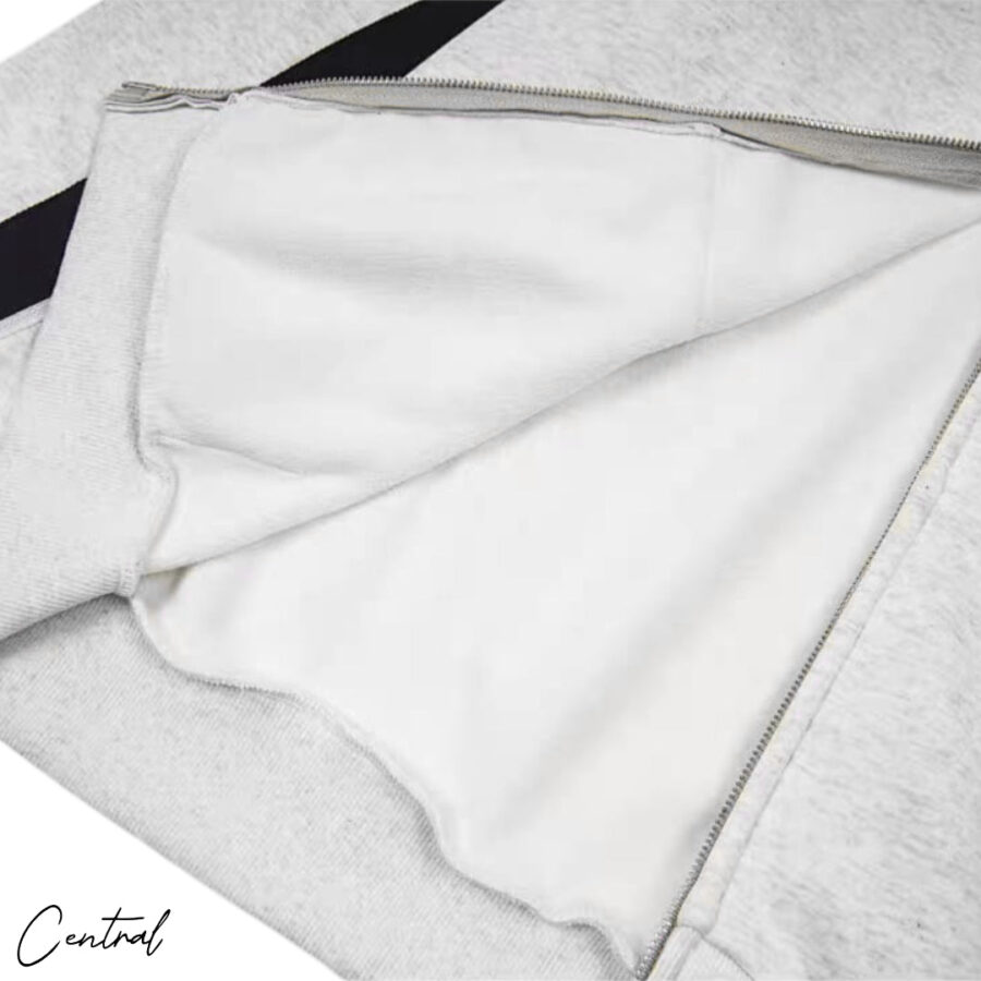 Corteiz Ribbed Sporteiz Zip Hoodie in black, featuring a full zip front and ribbed texture, displayed on a hanger.