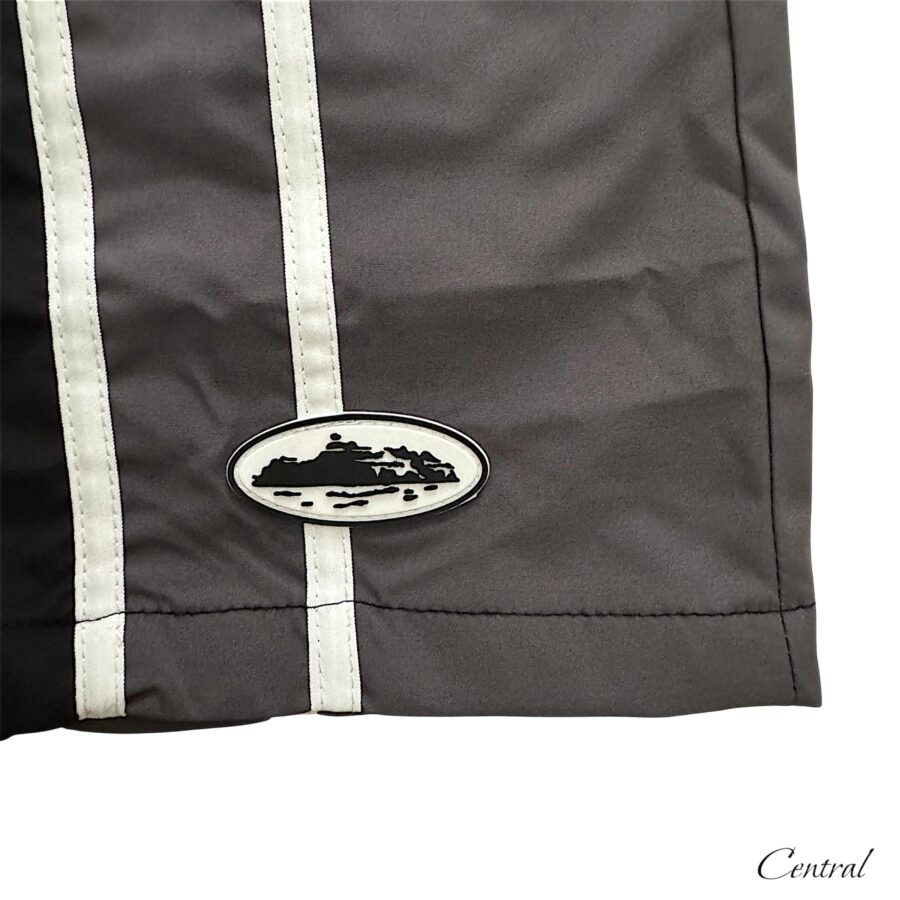 Black Corteiz shorts from Central.ae displayed on a flat surface, showcasing the fabric and design details.