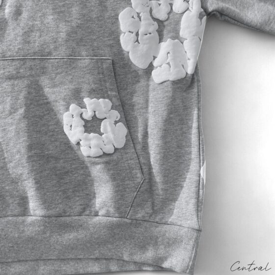 Gray Central ae hoodie featuring a cotton wreath design on the front, displayed on a neutral background.