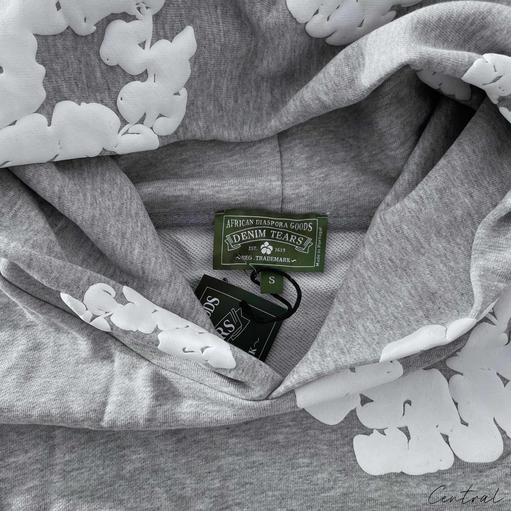 Gray Central ae hoodie featuring a cotton wreath design on the front, displayed on a neutral background.