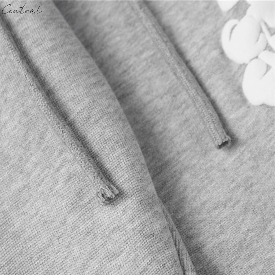 Gray sweatpants from Central ae featuring the Denim Tears Cotton Wreath design, showcasing a relaxed fit and soft fabric.