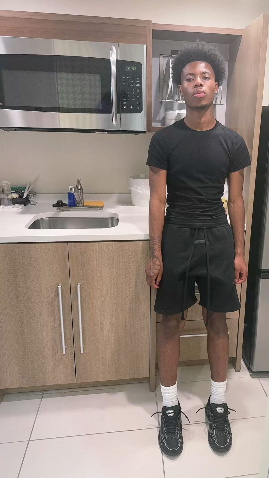 Essential black shorts from CENTRAL AE, featuring a relaxed fit and lightweight fabric for comfortable wear.