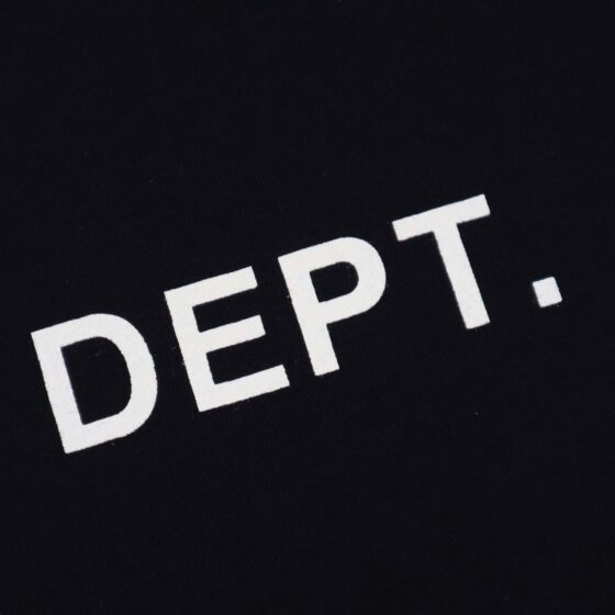 Black Gallery Dept Los Angeles T-shirt by Central ae displayed on a hanger, featuring a classic crew neck design.