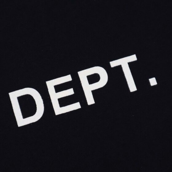 Black Gallery Dept Los Angeles T-shirt by Central ae displayed on a hanger, featuring a classic crew neck design.