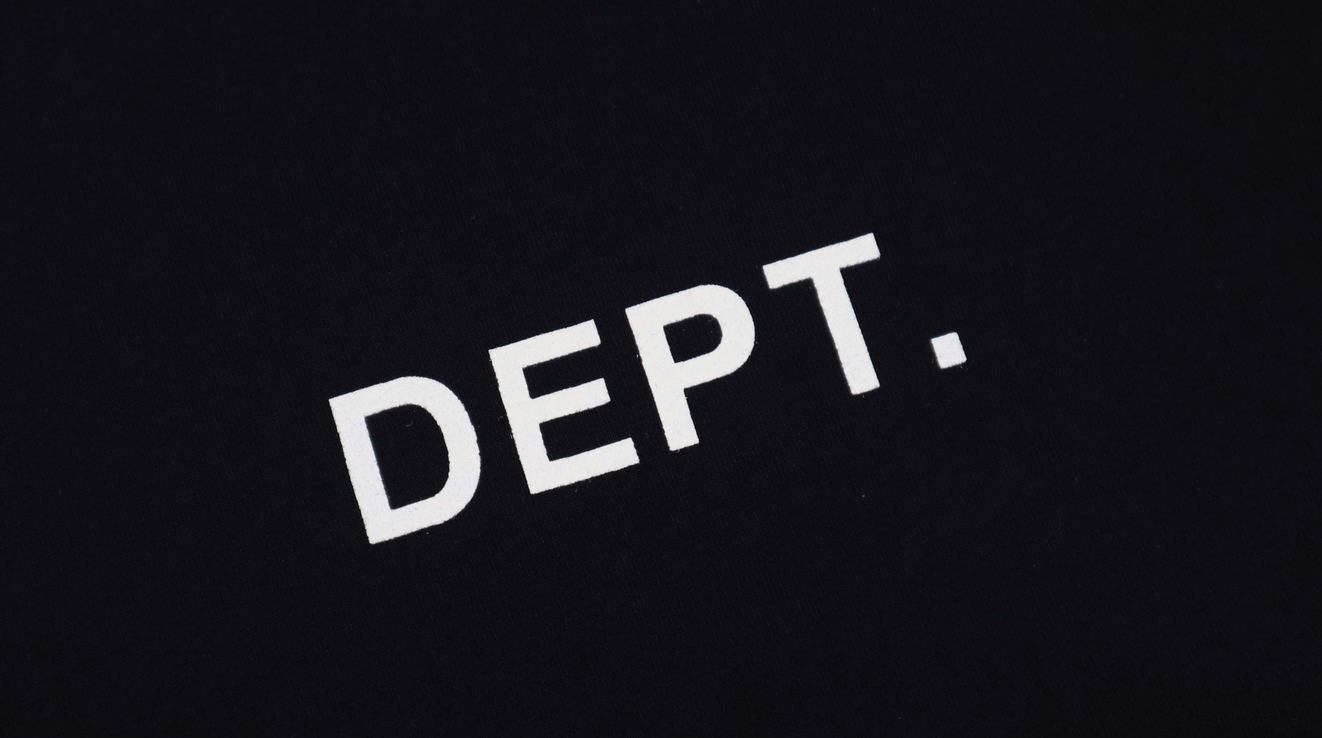 Black Gallery Dept Los Angeles T-shirt by Central ae displayed on a hanger, featuring a classic crew neck design.