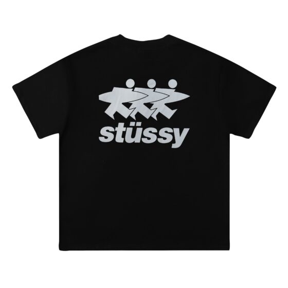 Black Stussy SURFWALK t-shirt featuring a bold graphic design, displayed on a flat surface.