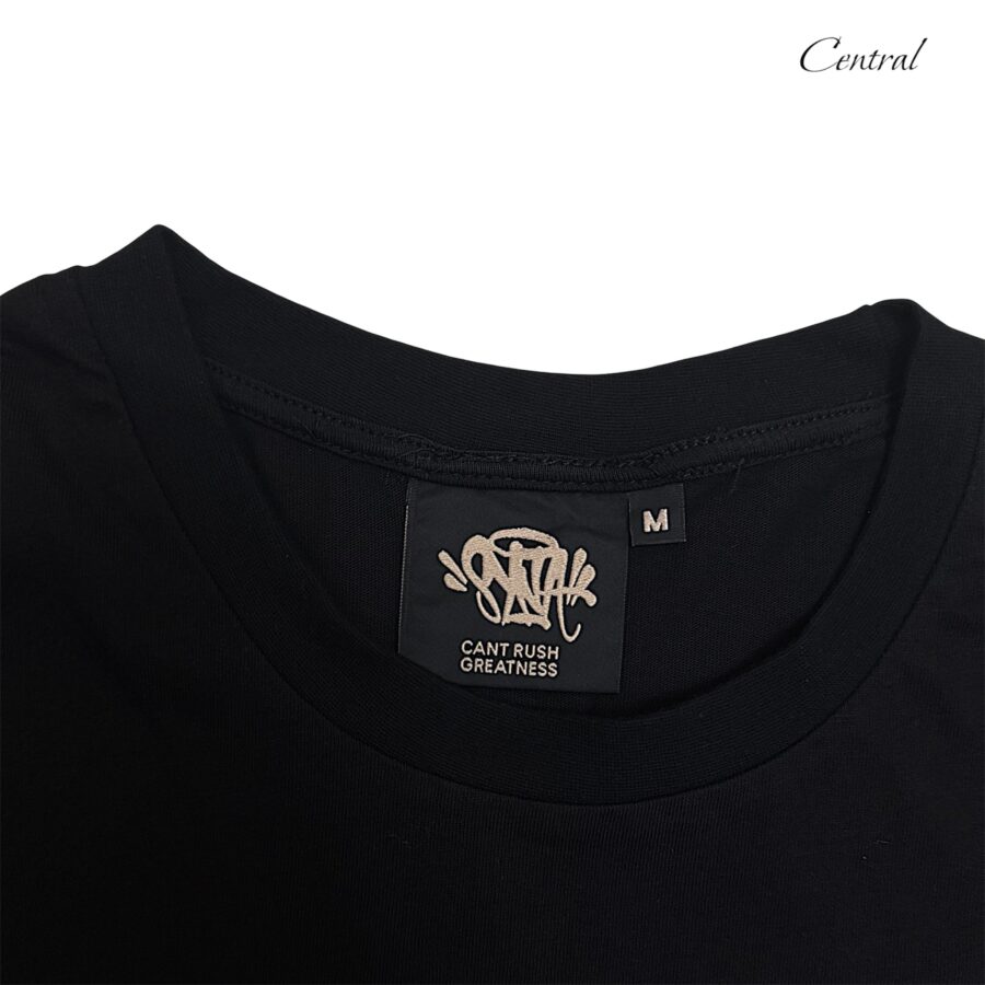 Black and rose gold Syna T-shirt and shorts set displayed on a neutral background.