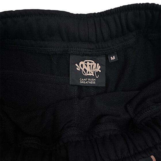 Black and rose gold Syna T-shirt and shorts set displayed on a flat surface. Casual style by Central.ae.