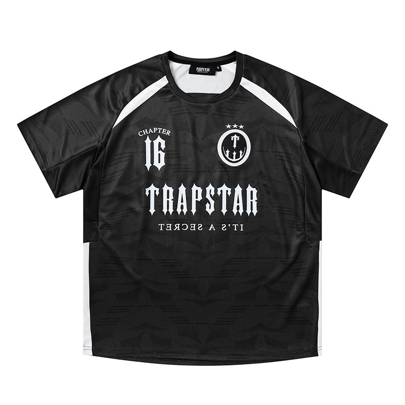 Trapstar X Clavish Chapter 16 Jersey in black, featuring bold graphic design and a relaxed fit.