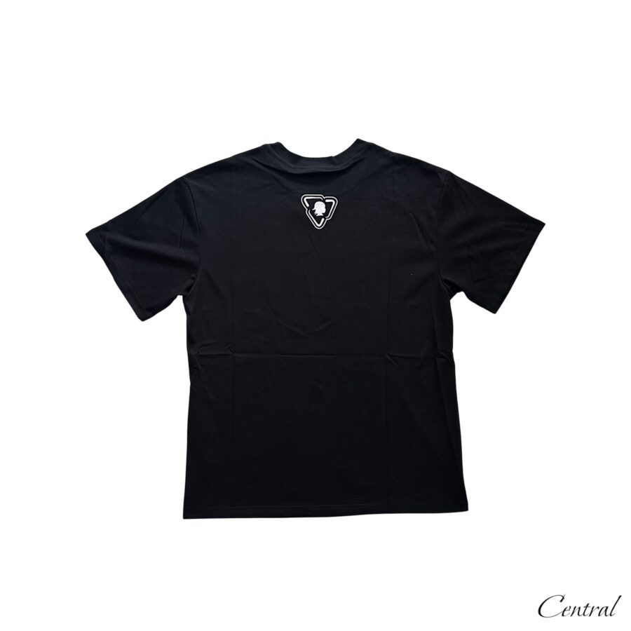 Black Trapstar x More Bands OTW Tee displayed on a hanger with logo and graphic design visible.