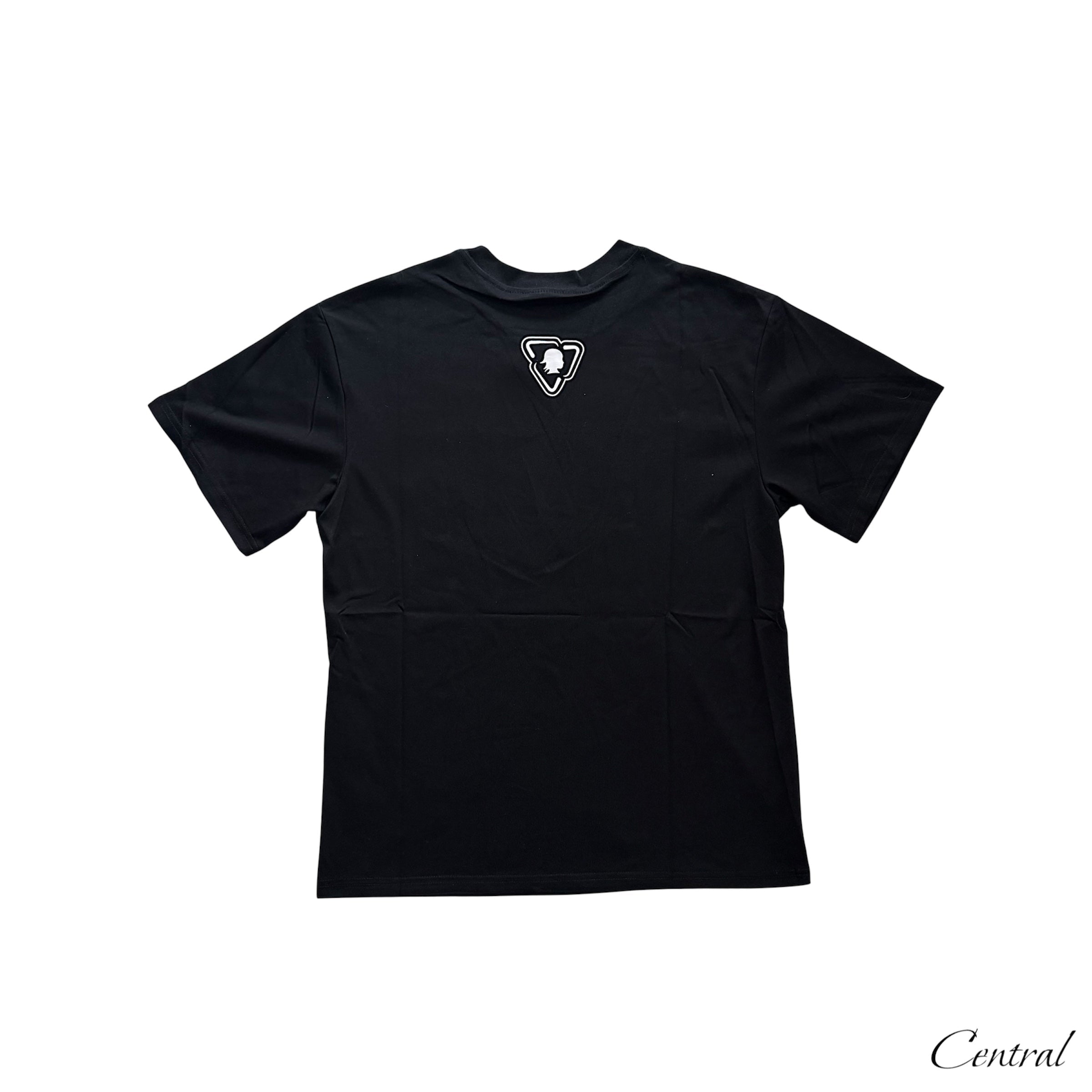 Black Trapstar x More Bands OTW Tee displayed on a hanger with logo and graphic design visible.