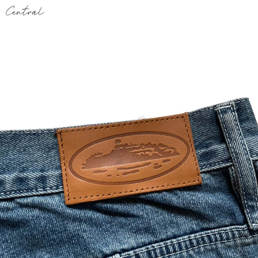 Corteiz C-Star denim shorts in a relaxed fit, featuring a classic blue wash and frayed hem detail.