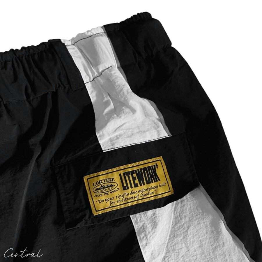 Black and white Corteiz spring shorts by Central ae, featuring a relaxed fit and stylish design.