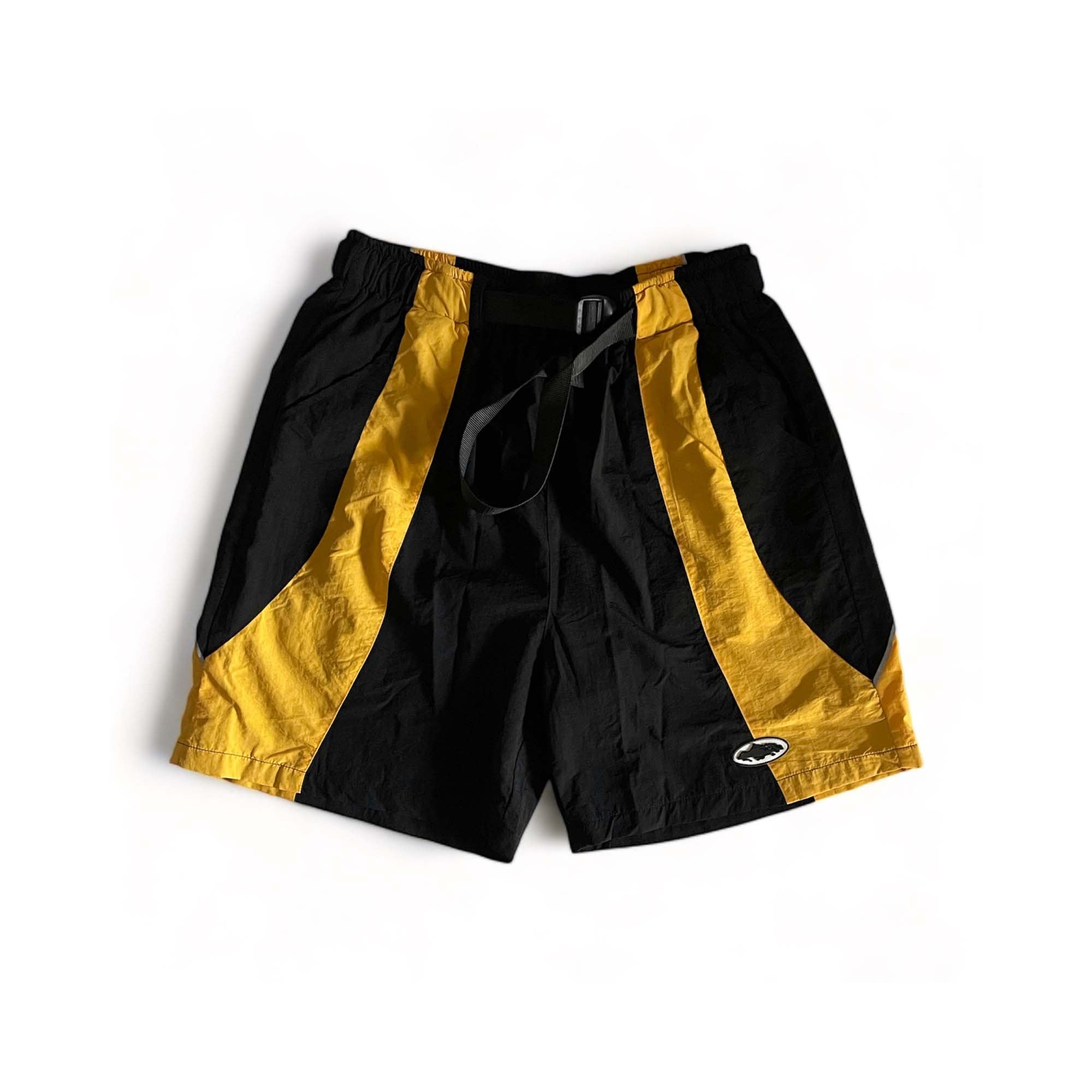 Black and yellow Corteiz spring shorts from Central ae, featuring a casual design and comfortable fit.