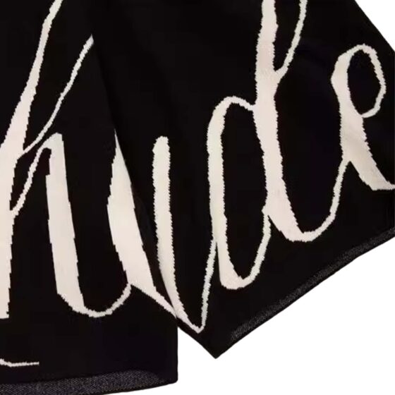 Black and cream Rhude Knit logo shorts by Central ae, showcasing a stylish design and comfortable fit.