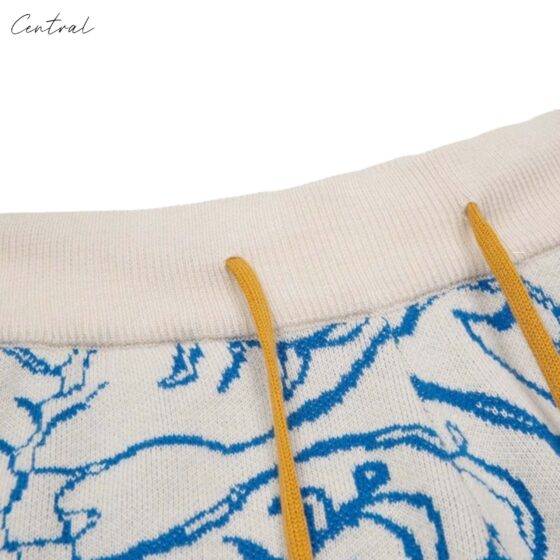 Crème and blue Rhude Knit Tile Shorts featuring a textured design and elastic waistband for comfort and style.