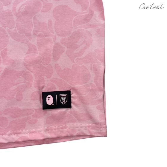 BAPE x Inter Miami pink camo t-shirt by Central ae, featuring a vibrant camouflage pattern and crew neckline.