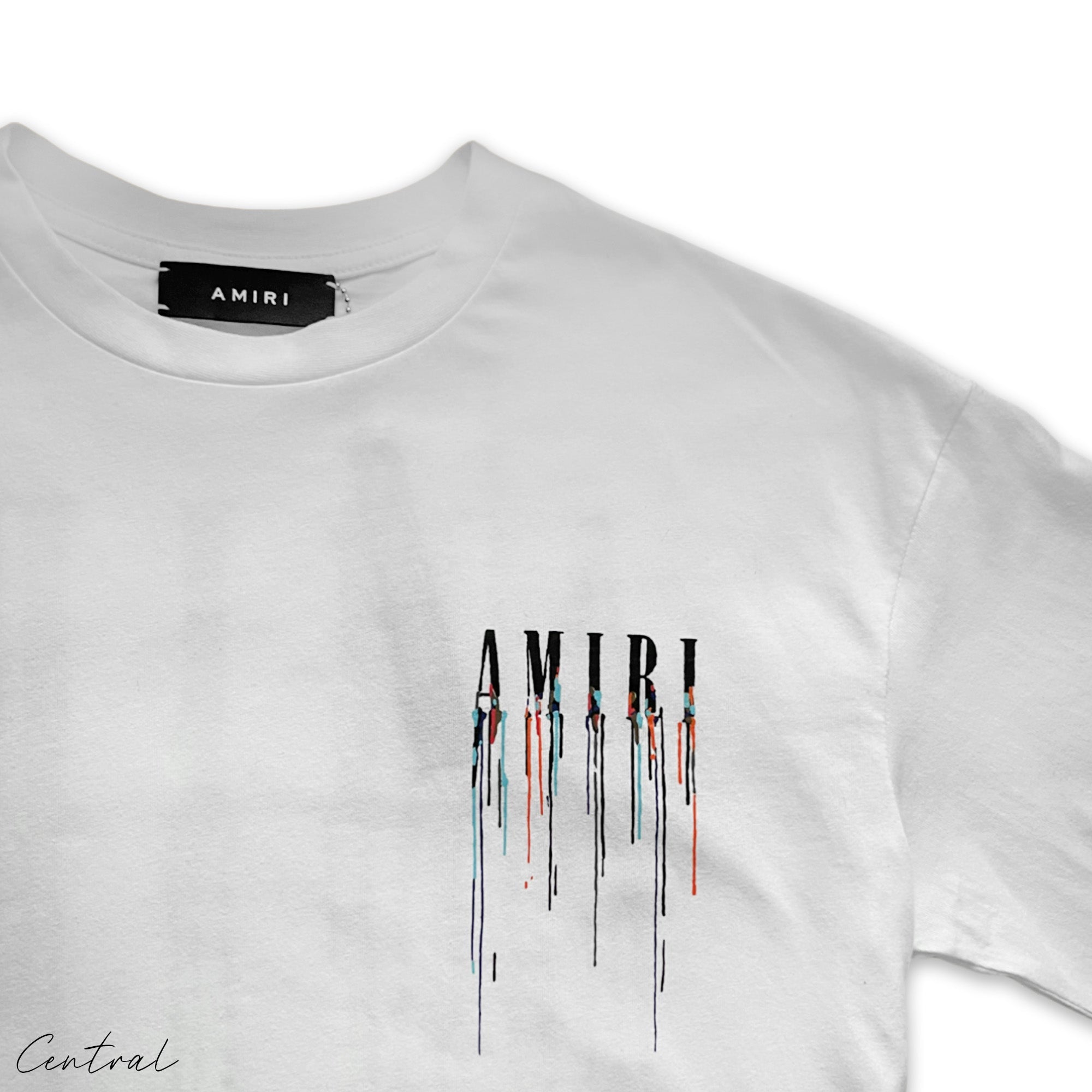 White Amiri Paint Drip T-Shirt by Central ae featuring unique paint drip design on a classic crew neck style.