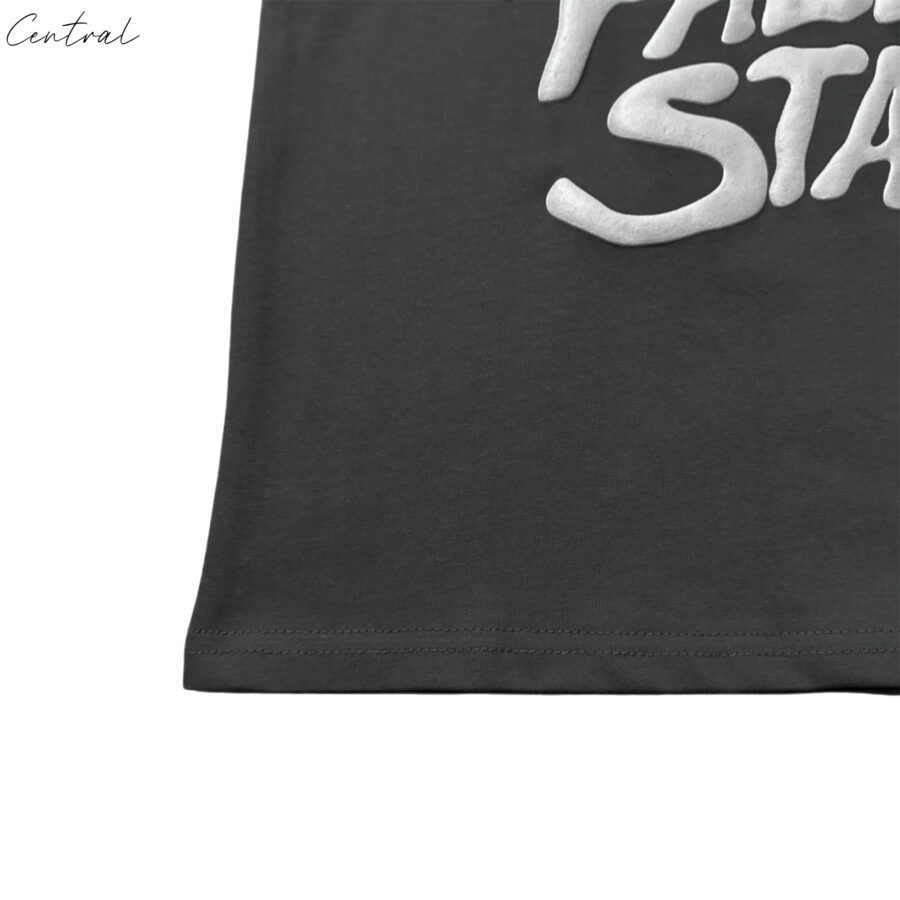 Central ae Broken Planet Falling Stars T-Shirt featuring a vibrant star graphic on a casual short-sleeve tee.