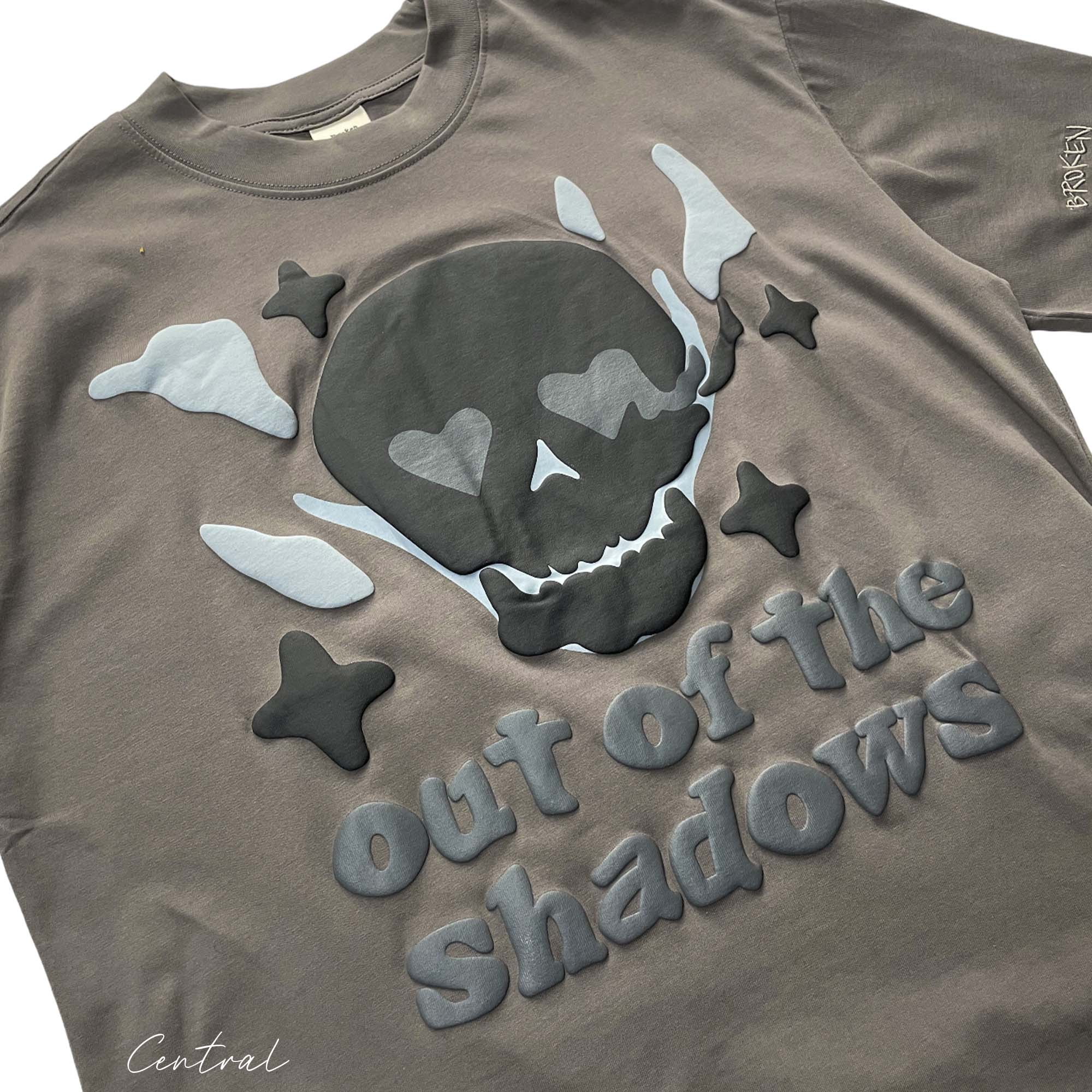 Central ae Out of the Shadows T-shirt featuring a unique graphic design and a comfortable fit on a casual background.