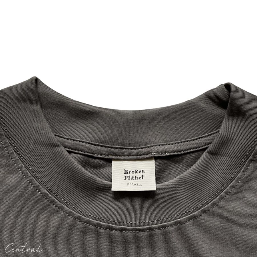 Central ae Broken Planet Out of the Shadows t-shirt featuring a bold graphic design on a soft, casual fabric.