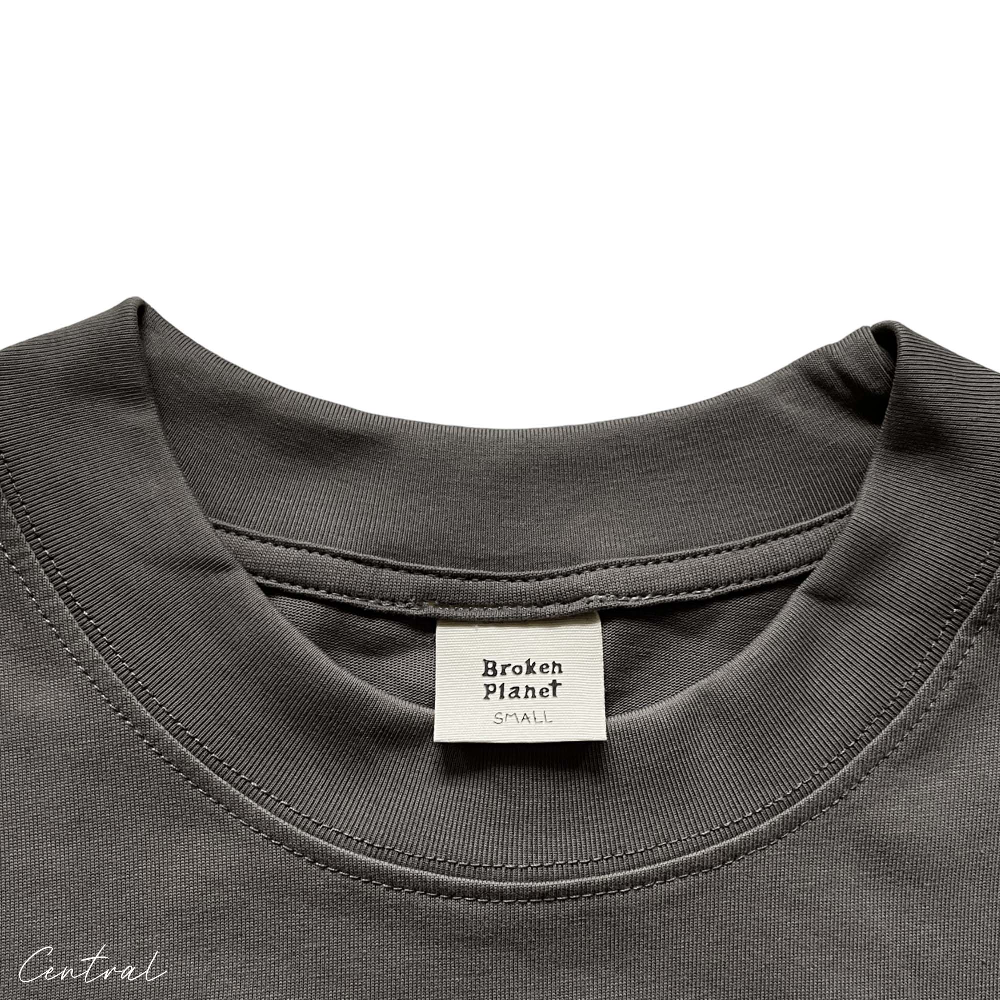 Central ae Broken Planet Out of the Shadows t-shirt featuring a bold graphic design on a soft, casual fabric.