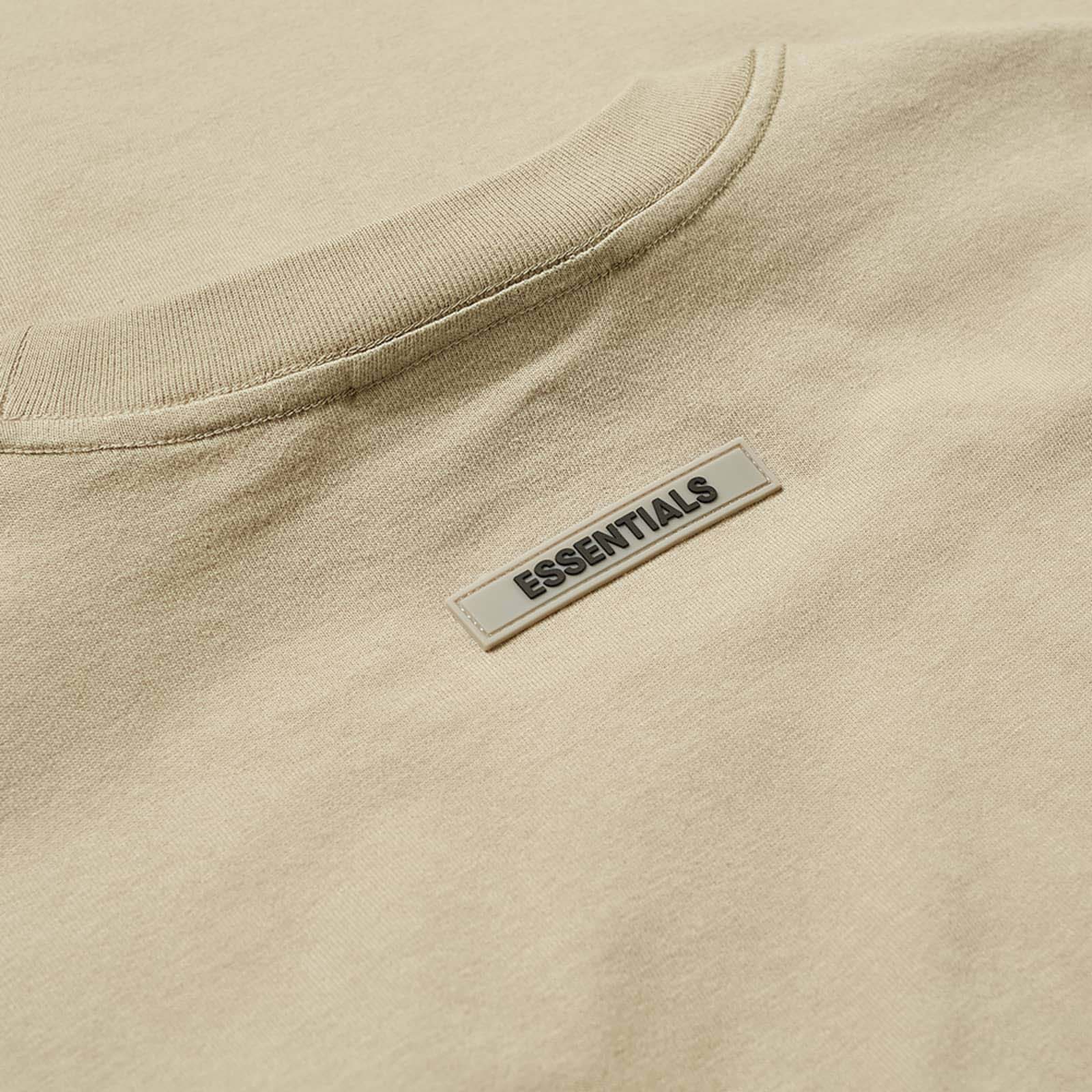 Khaki oversized FOG ESSENTIALS T-shirt featuring a relaxed fit and soft fabric, perfect for casual wear.