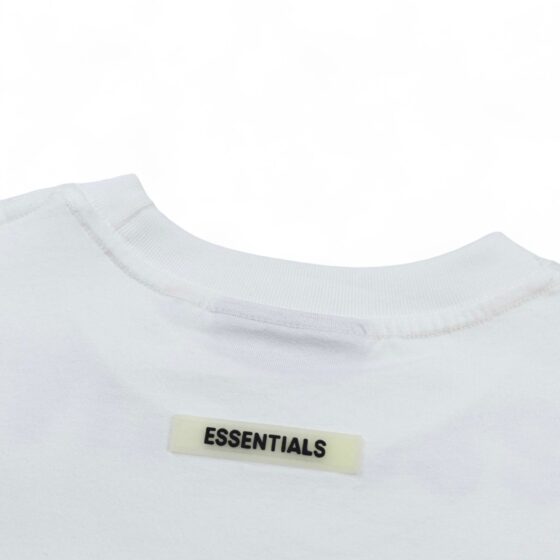 White oversized FOG ESSENTIALS T-shirt with a relaxed fit, featuring a simple design and soft fabric.