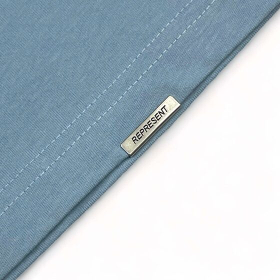 Powder blue REPRESENT OWNERS CLUB T-shirt featuring a relaxed fit and logo design from central.ae.