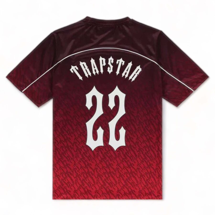 Red gradient Trapstar monogram jersey t-shirt featuring bold logo design and modern style.