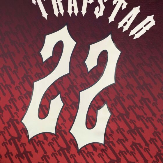 Trapstar red gradient monogram jersey t-shirt featuring bold logo design and a stylish modern fit.