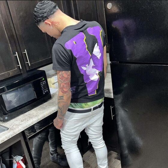 Vlone X Nav Doves T-Shirt featuring a unique dove graphic design on a classic black tee.
