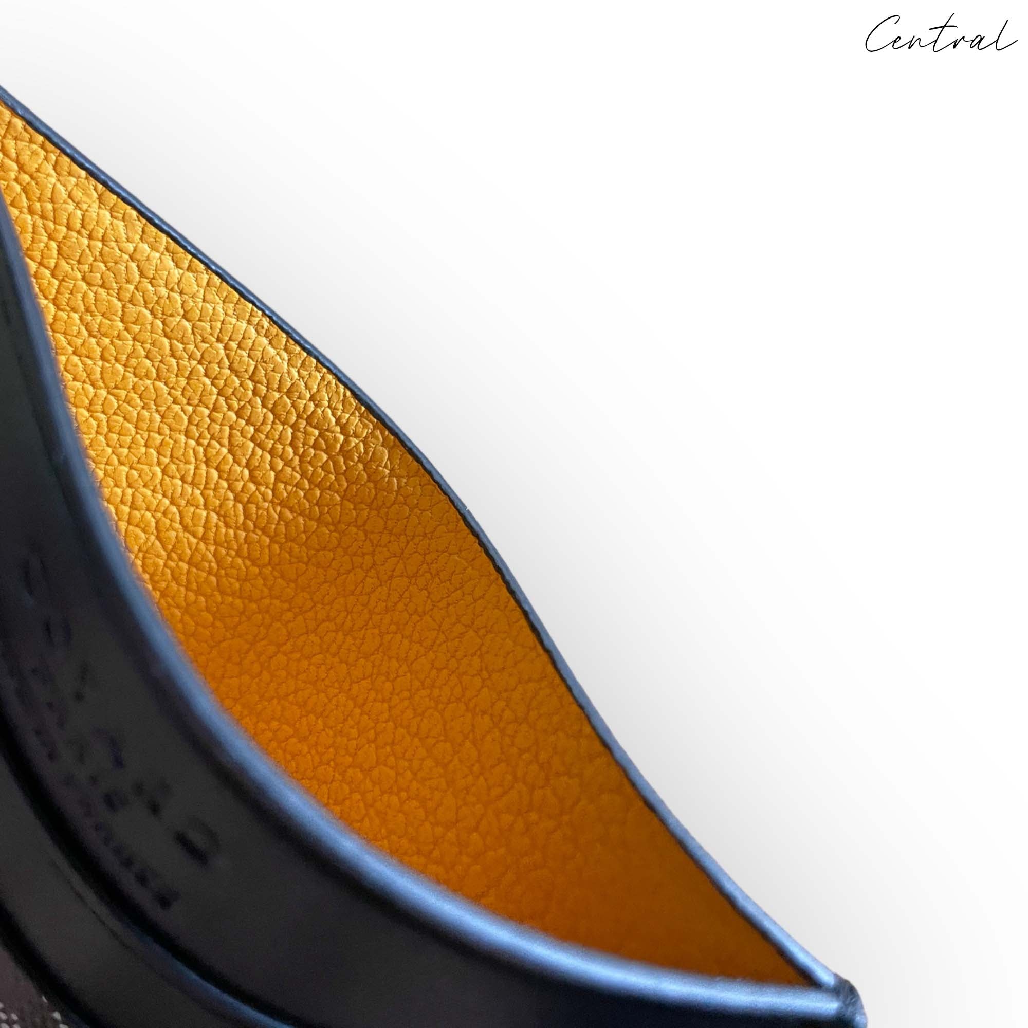 Black Goyard card holder wallet by Central ae, featuring a sleek design and signature logo pattern.