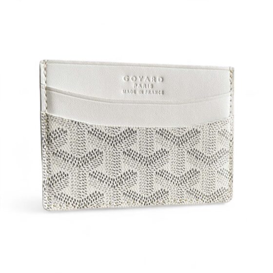 White Goyard card holder wallet by Central ae, featuring a sleek design and signature pattern.