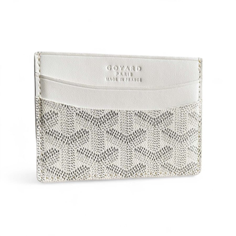 White Goyard card holder wallet by Central ae, featuring a sleek design and signature pattern.