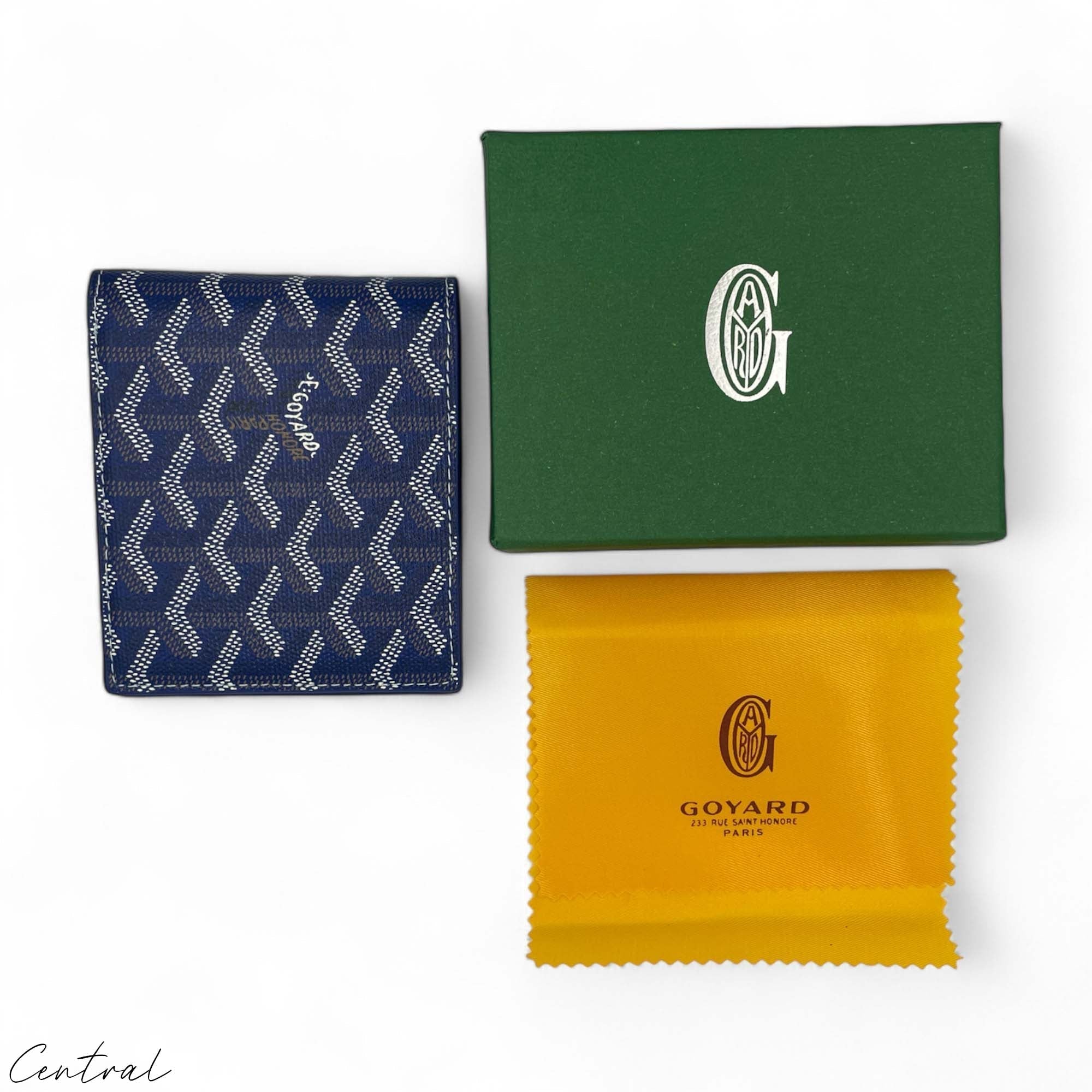 Blue Goyard wallet by Central ae featuring a sleek design and signature pattern on a textured leather surface.