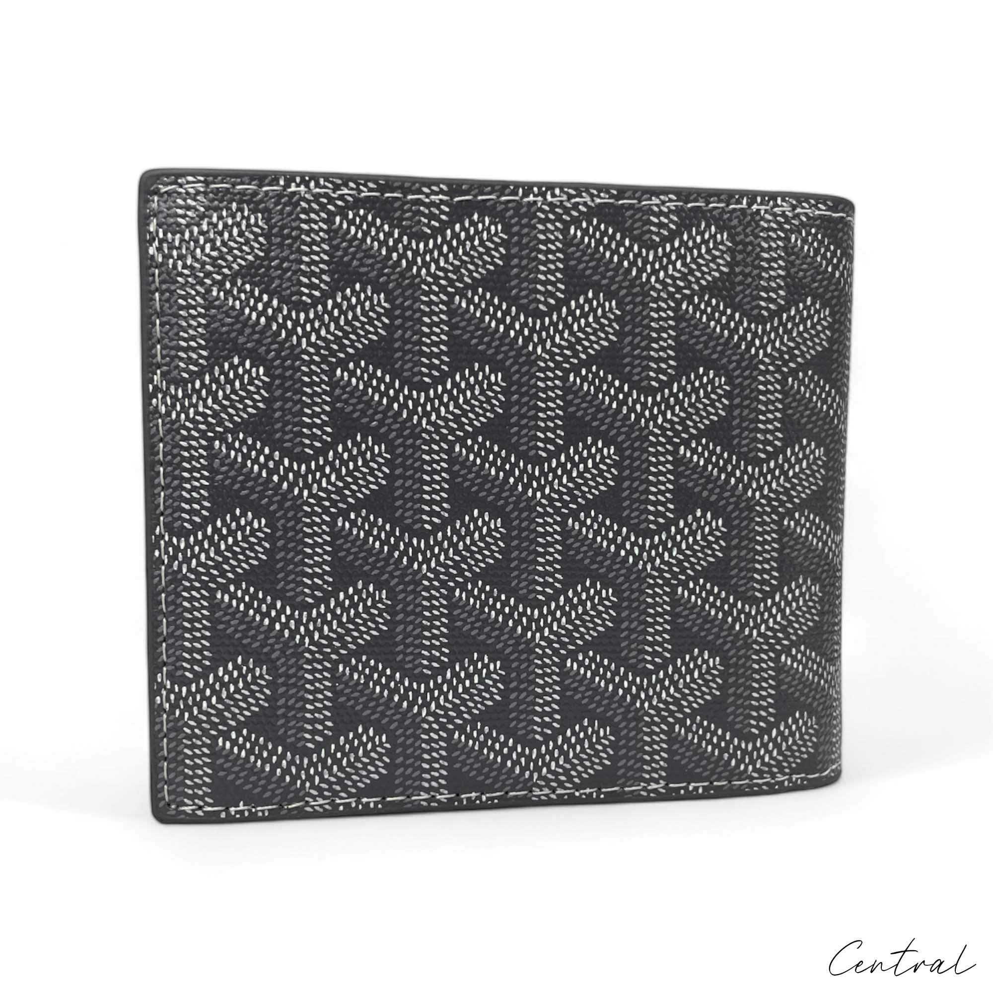 Gray Goyard wallet by Central ae with a sleek design and signature pattern showcased on a white background.