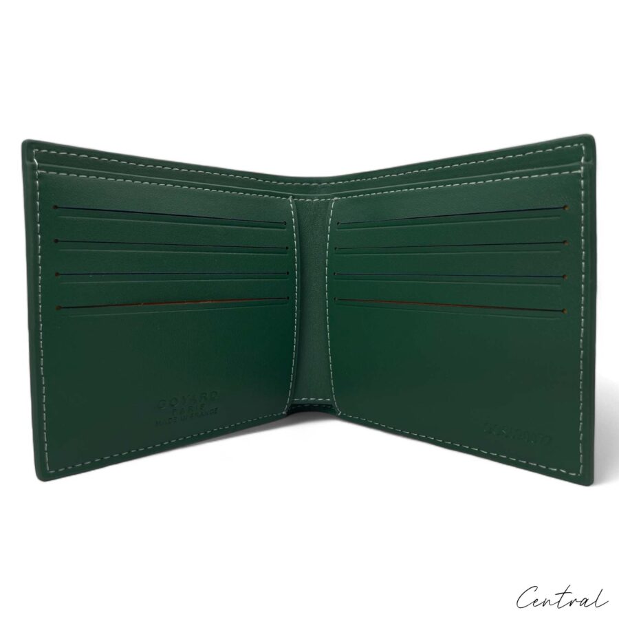 Green Goyard wallet by Central ae with signature pattern and sleek design, showcasing the brand's luxury craftsmanship.