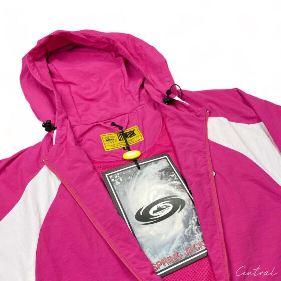 Corteiz pink spring hoodie displayed on a hanger, featuring a zip-up front and casual style for comfortable wear.