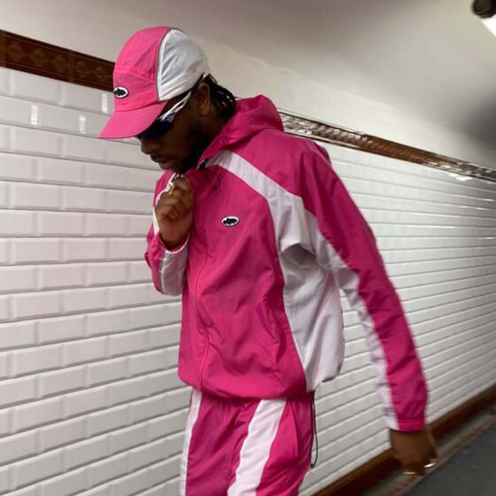 Corteiz pink spring hoodie with a relaxed fit and adjustable drawstring hood displayed against a neutral background.