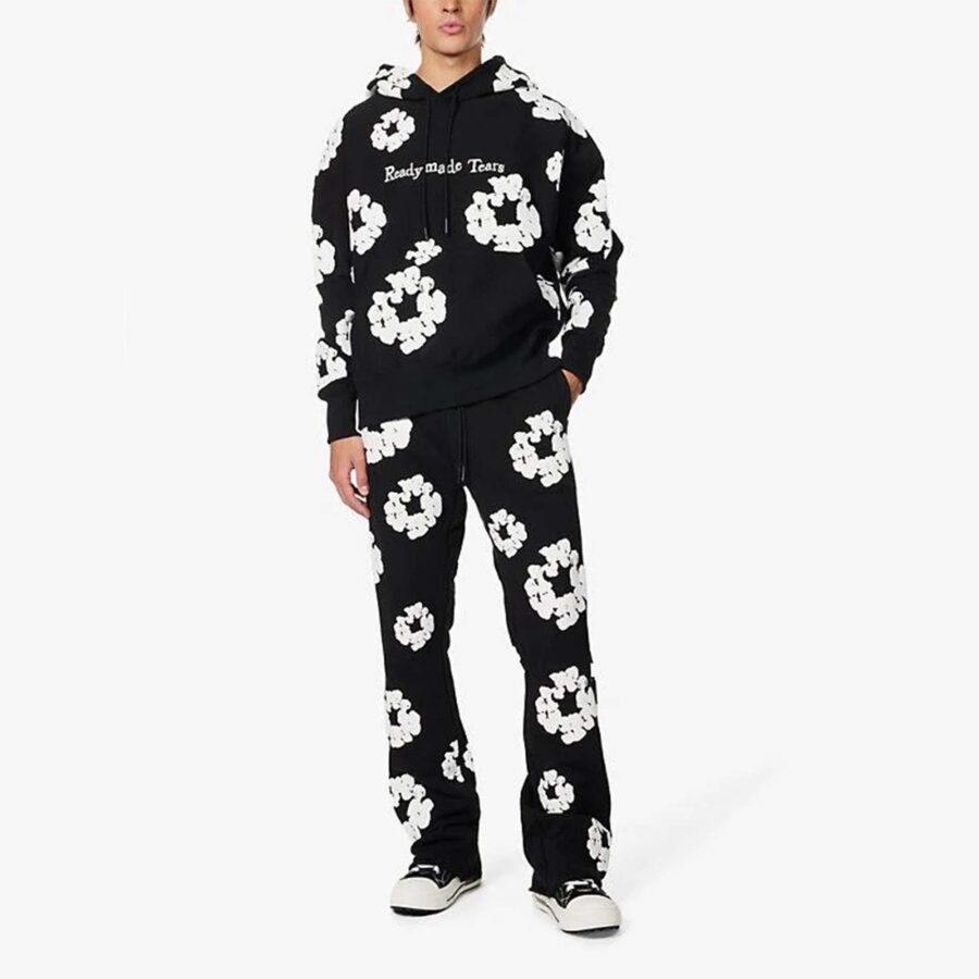 Black READYMADE x DENIM TEARS hoodie featuring a relaxed fit and logo graphics from the central brand.
