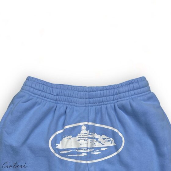 Baby blue Corteiz Alcatraz sweatpants featuring a relaxed fit and central logo on the left thigh.