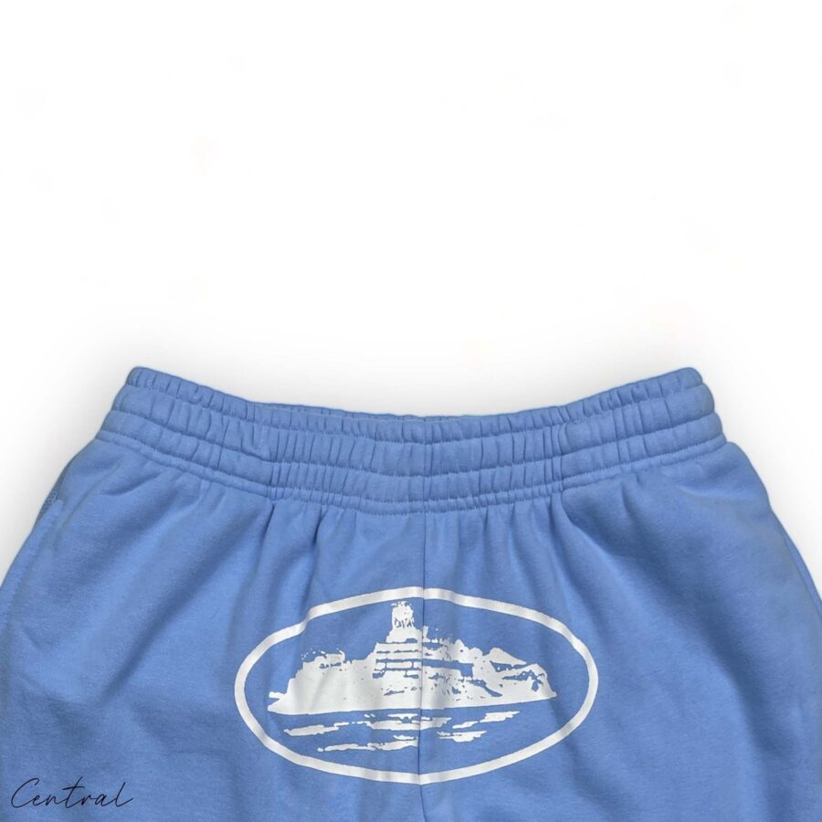 Baby blue Corteiz Alcatraz sweatpants featuring a relaxed fit and central logo on the left thigh.